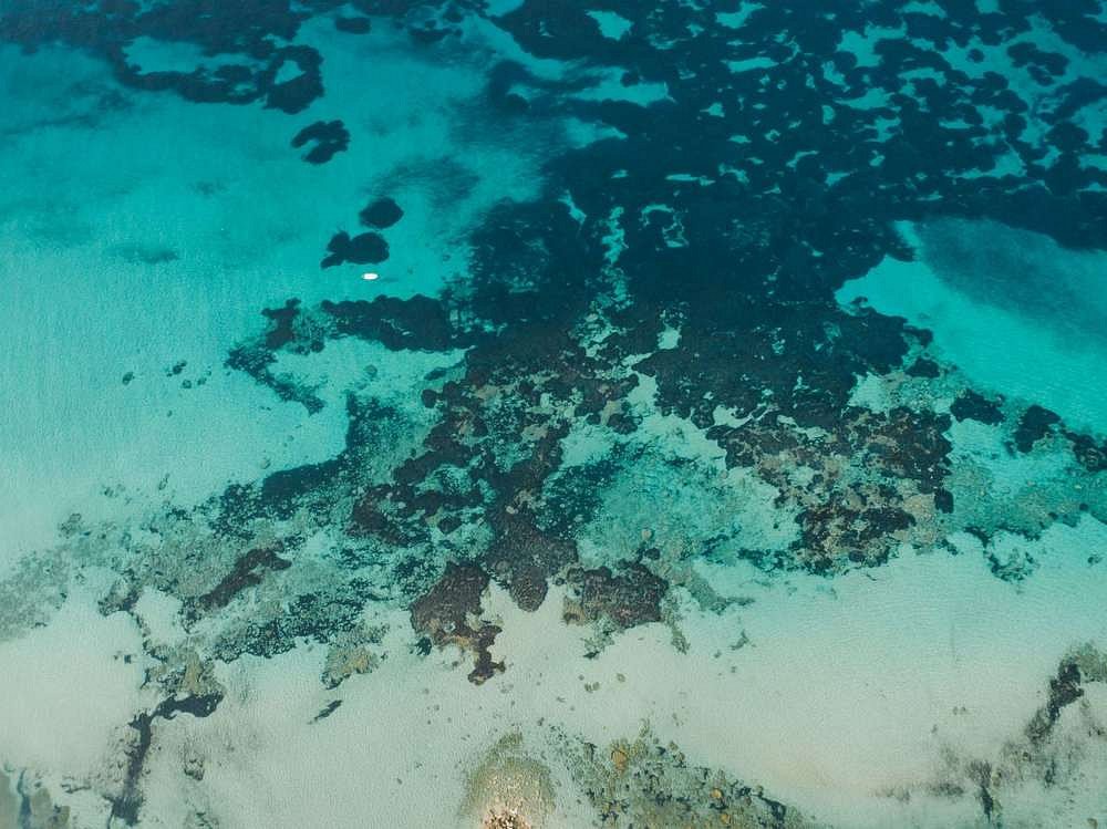 Aerial photo clear blue and turquoise waters of the Greek Mediterranean Sea