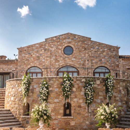 White elegant & comfortable destination wedding at a Greek manor venue and blue sky