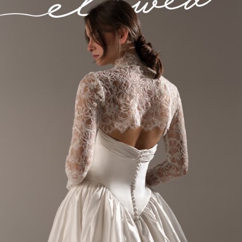 Back view of Nelly, dreamy wedding dress by Lihi Hod new collection featuring a dramatic silk Shantung ball gown, strapless sweetheart bodice topped with sheer delicate lace sleeves and a flattering dropped v-waist flowing into a voluminous skirt with rich architectural folds, a low back with satin-covered buttons down the back