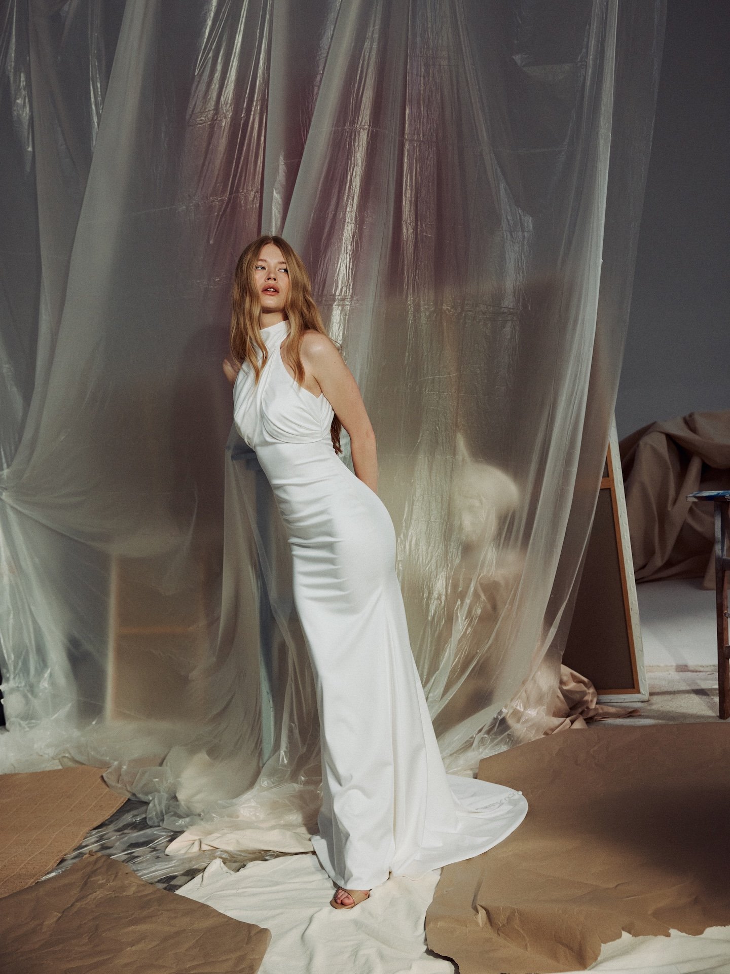 Fitted satin wedding dress with Greek Goddess-like design features 