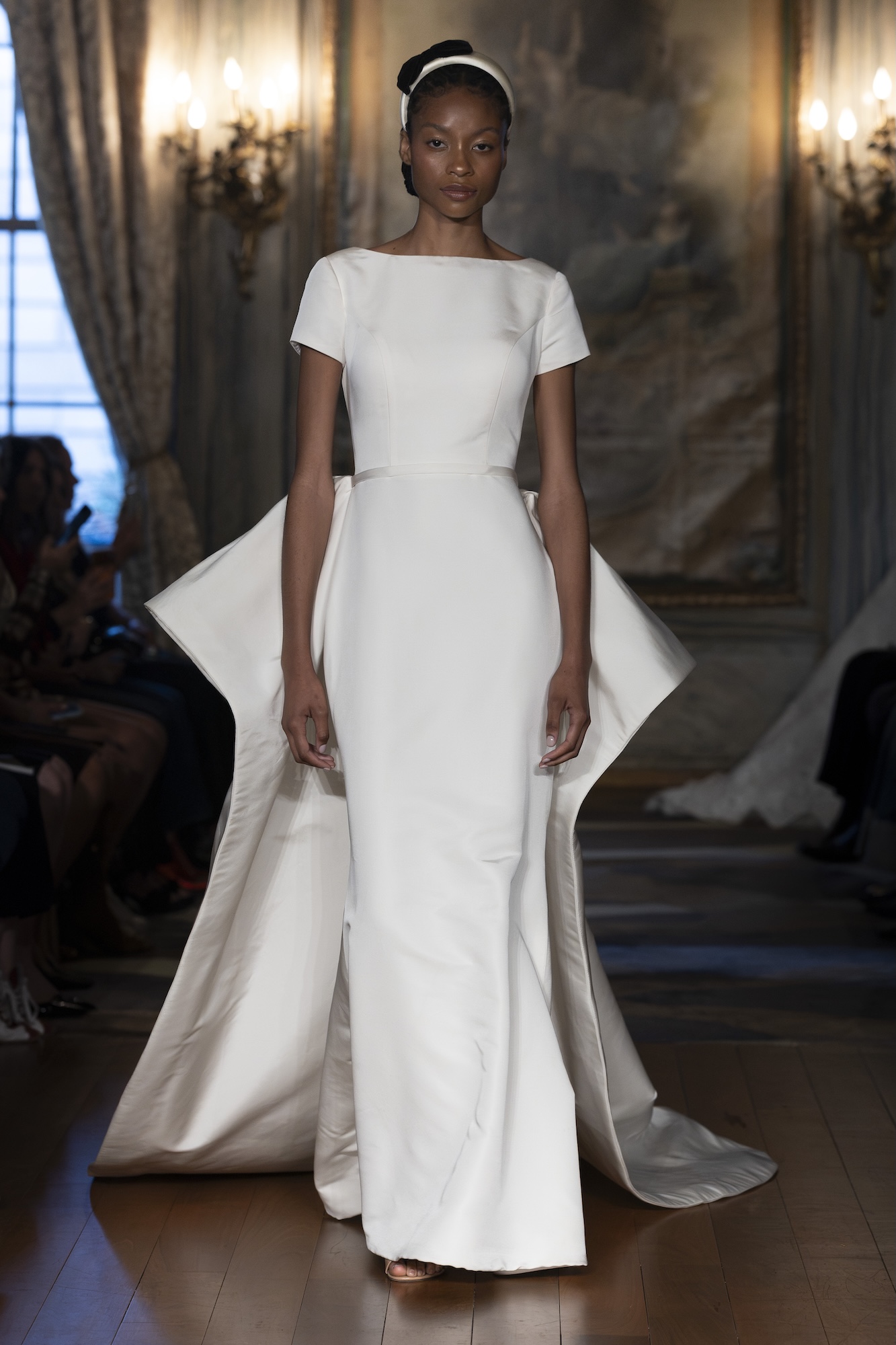 Sareh Nouri Fall 2027 collection wedding dress with dramatic train at the bridal fashion week catwalk in New York