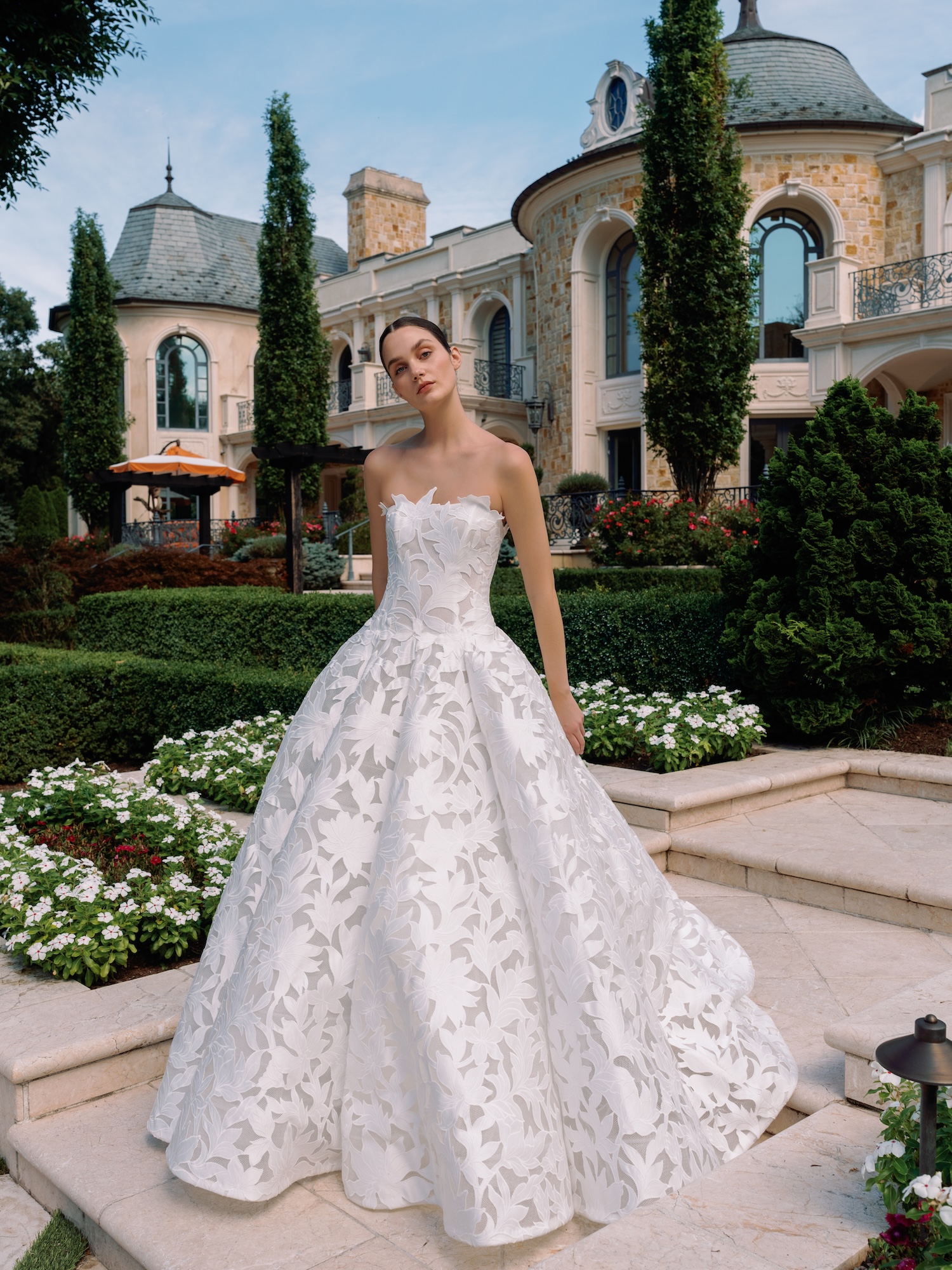 Laser cut organza strapless wedding dress straight across scallop trim neckline with dropped waist semi sheer bodice and dramatic semi sheer coned skirt