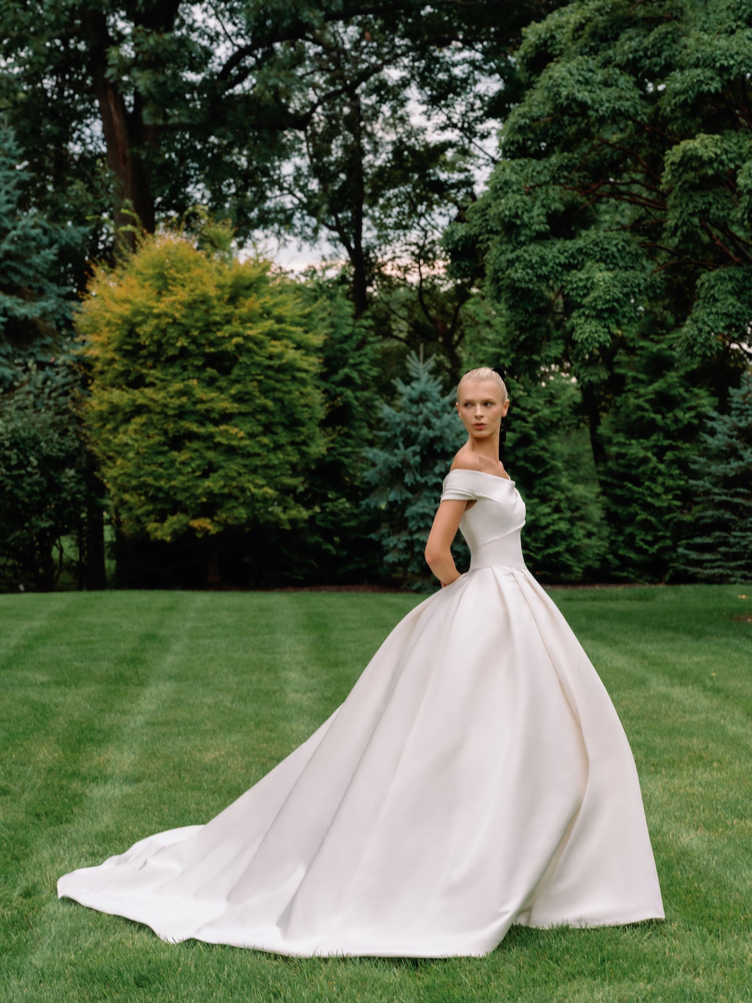 The Heiress Silk Faille cowl neckline wedding dress with draping throughout the bodice and ballgown skirt in green field